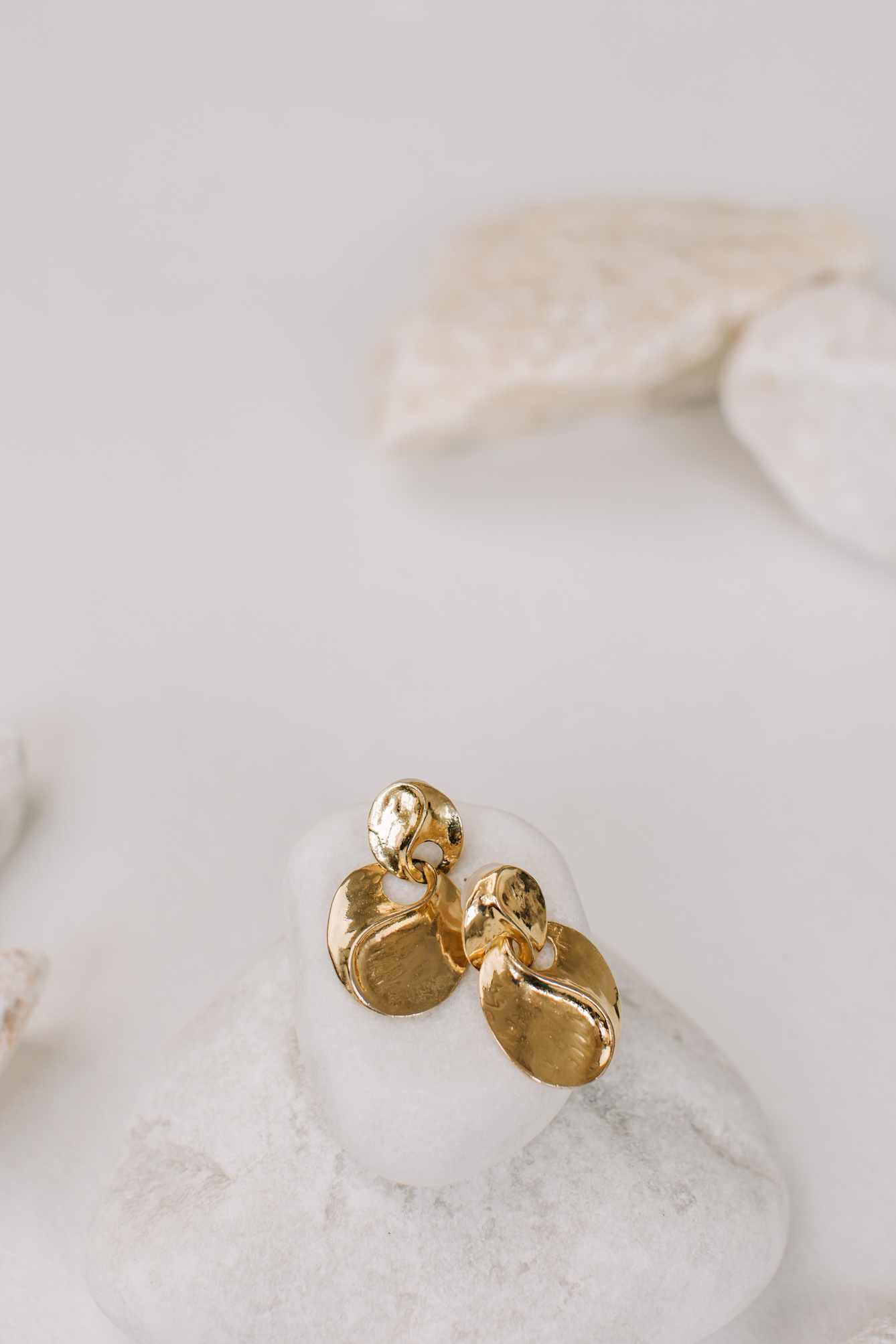 Gold Earrings on a Rock